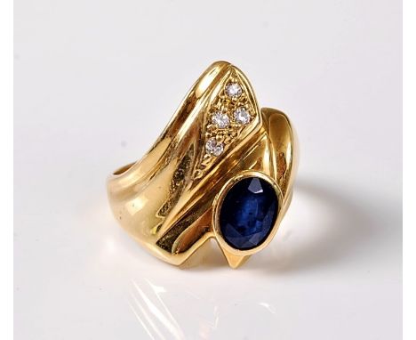 A 14ct sapphire and white hardstone ring, the oval sapphire, approx. 7.2 x 5.3mm, in a rubover mount, asymetrically set in an