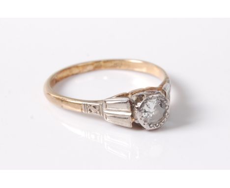 An early 20th century 18ct diamond solitaire ring, the illusion set old round brilliant cut diamond, estimated approx. 0.17ct