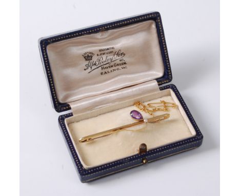 A 15ct amethyst and cultured pearl bar brooch, the pear shaped amethyst in millegrain collet mount set with a single small cu