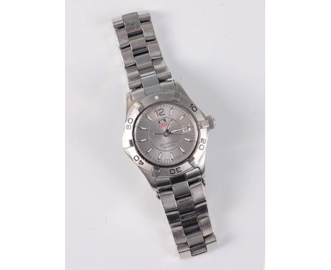 A lady's Tag Heuer Aquaracer steel wristwatch, the round brushed steel dial with luminous baton numerals and hands, seconds h