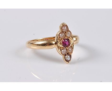 An 18ct ruby and pearl ring, the central round ruby set with three small pearls above and below in a navette shaped plaque, a