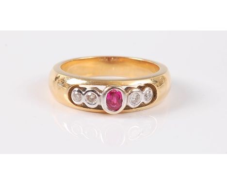 A ruby and diamond ring, the central oval ruby, set to either side with two slightly graduated round brilliant cut diamonds, 