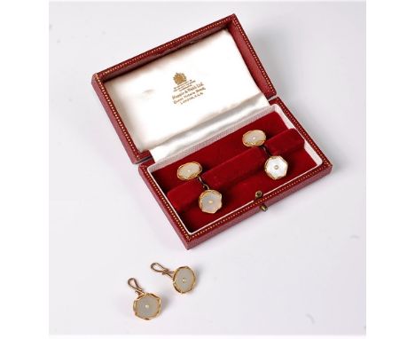 A pair of mother of pearl and split pearl cufflinks, the round mother of pearl discs set to centre with a small split pearl, 