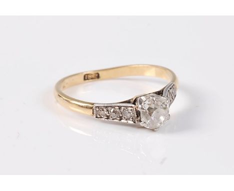 A diamond solitaire ring, the old mine cut diamond, estimated approx. 0.45cts, claw set in white metal with three small singl