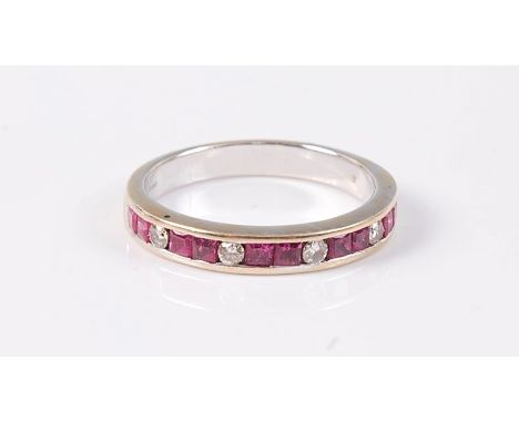 An 18ct ruby and diamond half hoop ring, comprised of two square cut rubies and a single round brilliant cut diamond, all cha