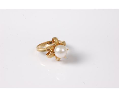 A continental cultured pearl dress ring, the drilled cultured pearl, rotating within a six claw mount and six further outswep