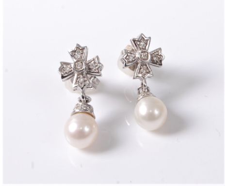 A pair of 9ct white gold cultured pearl and diamond earrings, comprising of a single cultured pearl with diamond studded coll