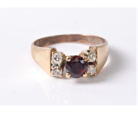 A synthetic ruby and diamond ring, the round ruby in a four claw mount, with two round diamonds to either side, total estimat