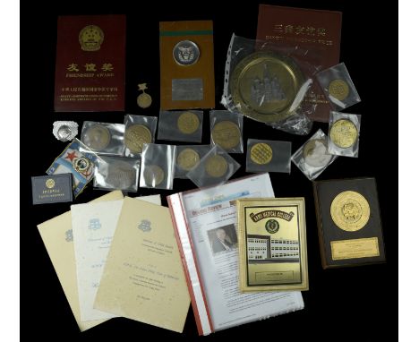 Medals and plaques presented to Dr Thomas Stapleton, mostly Chinese and Russian, including the Chinese Friendship Award, some