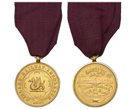 Midland Railway Ambulance, a gold award medal by A.H. Darby, dragon in quadrilobe, rev. tablets, named (Awarded to Frederick 