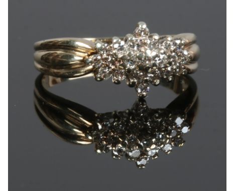 A 9ct gold diamond cluster ring, size M.