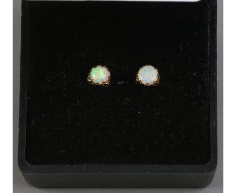 A pair of 9ct gold opal ear studs.