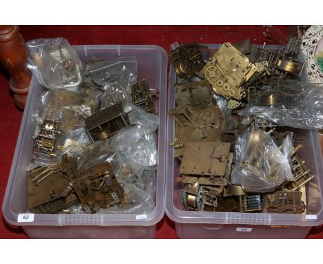 Two boxes of clock movements.