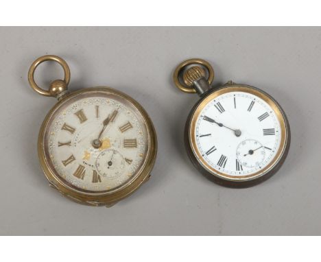 A brass cased railway time keeper pocket watch, along with a gun metal cased example with white enamel dial.
