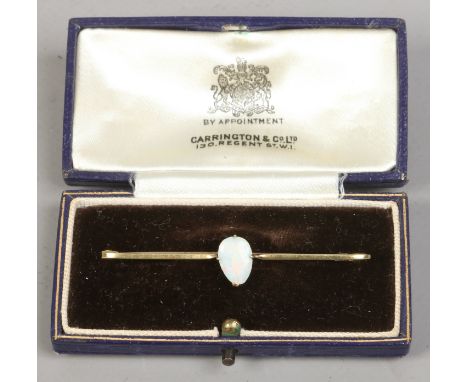 A cased 15ct gold bar brooch set with an opal.