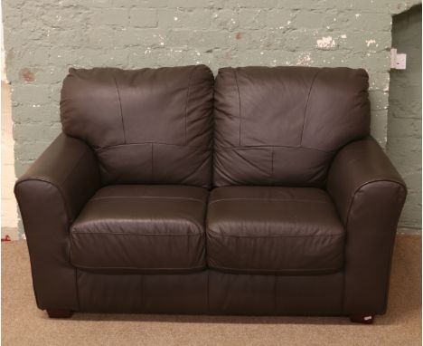 A brown leather two seat sofa.