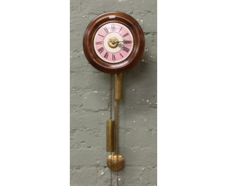 An early 20th century mahogany cased postmans alarm clock with coloured enamel dial Roman numerals and brass alarm set disc b