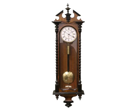 A 19th century walnut cased Vienna wall clock with bobbin turned ebonized decoration, enamel and brass dial, second subsidiar