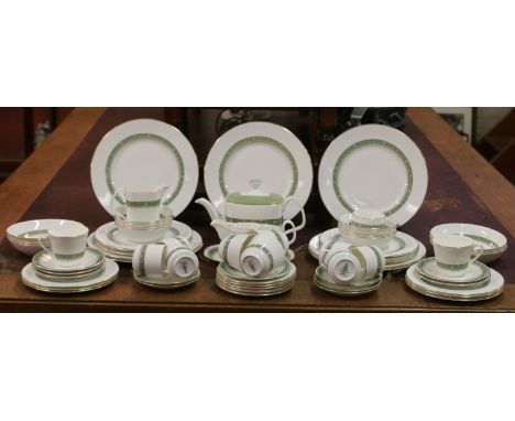 A Royal Doulton bone china tea/dinner service decorated in the Rondelay design including plates, side plates, sauce boat, tea