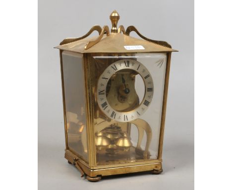 A brass torsion clock for repair.