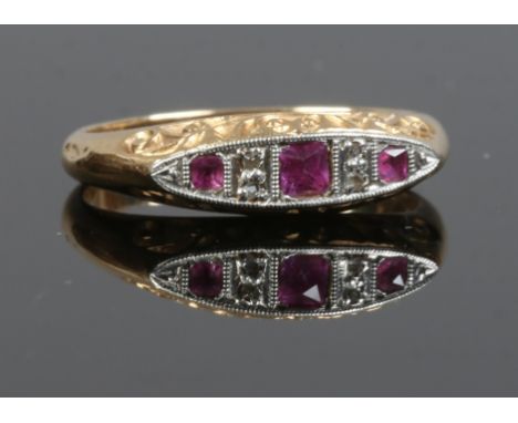 An 18ct gold diamond and ruby ring in boat shaped setting, size I1/2.