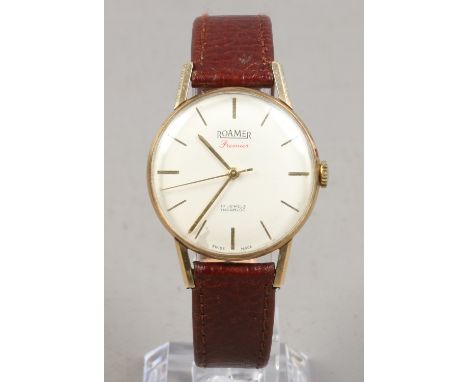 A gentlemans Roamer Premier cut gold cased manual wristwatch. With satin dial, baton markers and centre seconds, Glasgow 1963