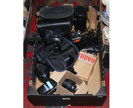 A box of photographic equipment including a Kodak digital camera, lenses, along with two pairs of cased binoculars.