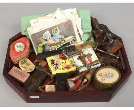 A tray of collectables including postcard clock keys, snuff boxes and knife rests etc.