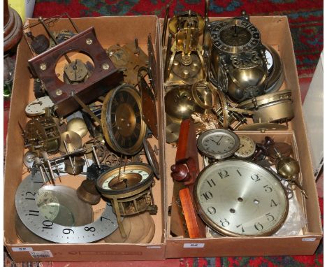 Two boxes of clock spares including enamel dials, movements, swing pendulum example etc.