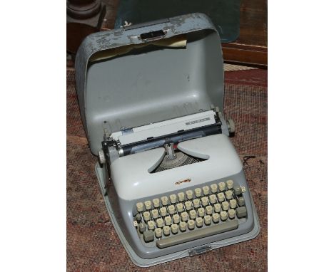 A vintage steel cased Adler Primus typewriter.