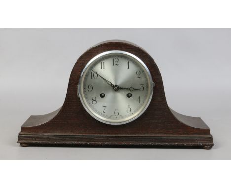 An oak cased mid C20th mantle clock housing a two train movement.