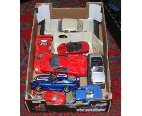 A box of model cars to include Burago 1/18 scale examples.