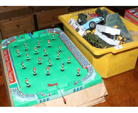 A box of Matchbox and Corgi Diecast model toy vehicles to include military examples along with a Chad Valley football stadium