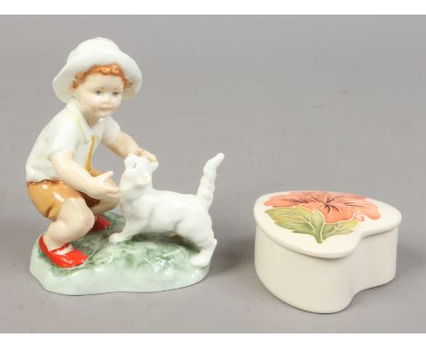 A Royal Worcester figure by F.G. Doughty snowy, along with a Moorcroft trinket box and cover decorated in the hibiscus patter