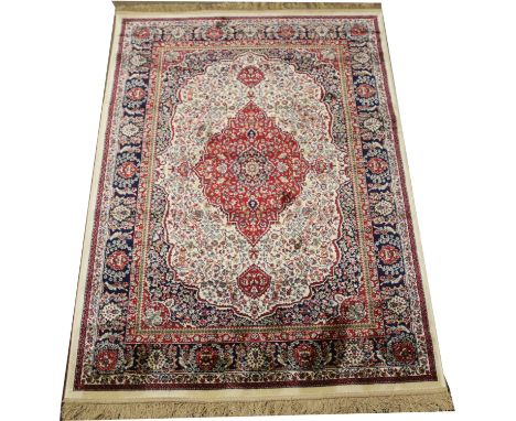 An ivory ground Cashmere traditional medallion design carpet square, 176 x 110.7cm.