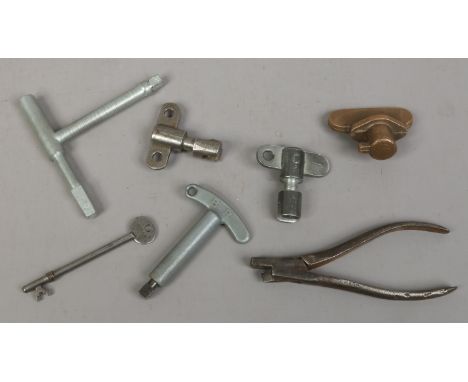 A bag of six unusual keys possibly railway related along with a vintage ticket clipper.