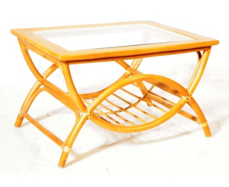 A vintage mid 20th century Italian manner bamboo and glass coffee table. The coffee table featuring circular banded base deta