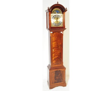 A contemporary mahogany cased longcase clock with Westminster chime action and moonphase dial. The dial marked for Smallcombe