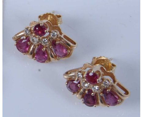 A pair of 14ct yellow gold, ruby and diamond fan shaped earrings, each featuring three pear shaped and one round faceted ruby