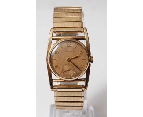 A Gents yellow metal Longines manual wind wristwatch, having champagne Arabic dial with subsidiary seconds dial at 6 o'clock,