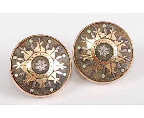 A pair of 9ct circular earrings, each comprising a centre panel of possibly vulcanite, inlaid with a yellow, pink and green m