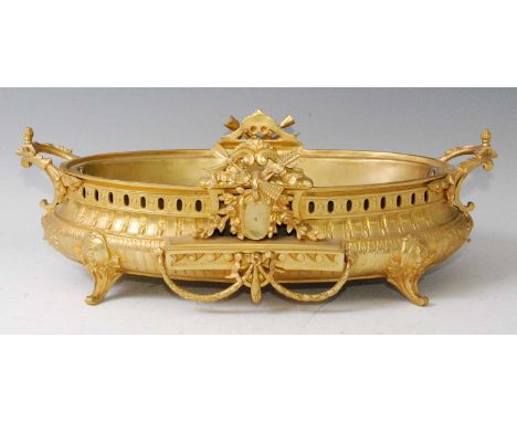 A 19th century gilt bronze jardiniere, of bellied oval form, having end carry handles, opposing details of flowers, arrow and