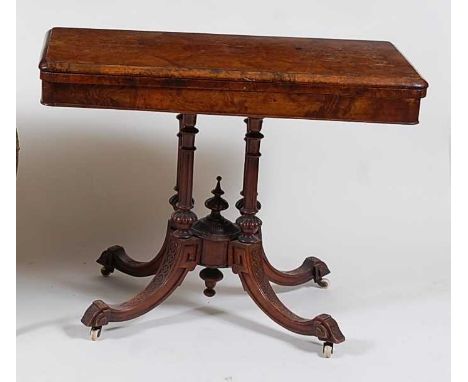 A Victorian figured walnut pedestal card table, the fold-over top having swivel action and opening to reveal baize lined play