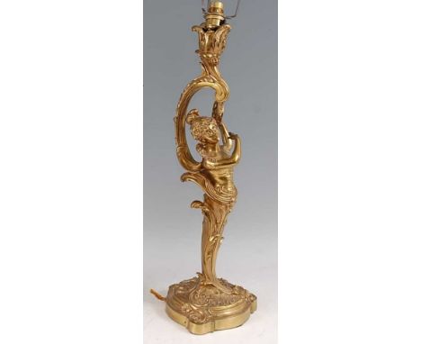 A large circa 1900 French gilt bronze Rococo Revival table lamp, of floral cast C-scroll upper form, over column modelled as 