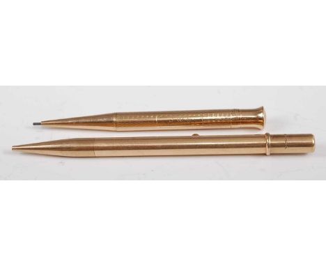 A George V 9ct gold propelling pencil, having engine turned case, presentation inscribed cartouche, assayed Birmingham 1930, 