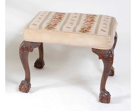 A mahogany framed dressing stool, in the Georgian style, early 20th century, having a woolwork upholstered stuffover seat, on