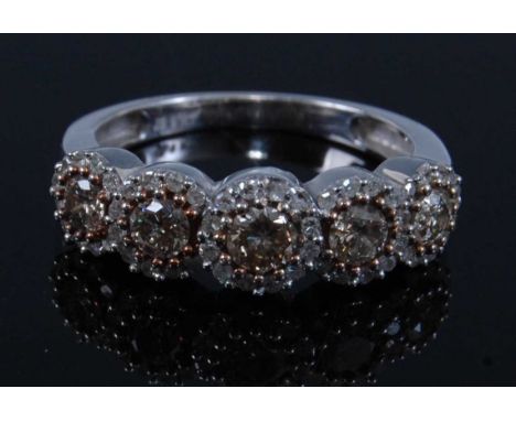 A 9ct white gold diamond half hoop eternity ring, comprising five graduated fancy light brown brilliant cut diamonds within a