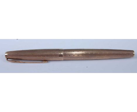A Parker 61 9ct gold cased fountain pen, having signed engine turned case, gross weight 25g, 13.5cm, no box