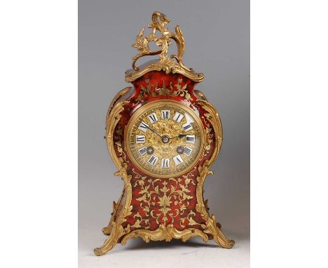 A 19th century French boulle and gilt metal mounted balloon shaped mantel clock, the case with cut brass scroll leaf inlays, 