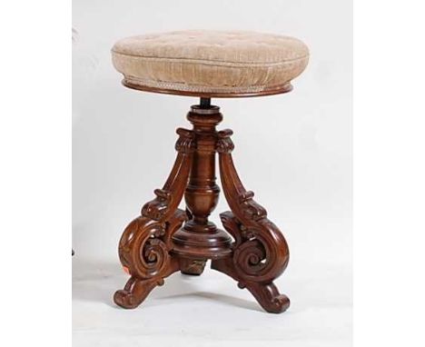 A late Victorian walnut music stool, having revolving stuffover seat, dia.37cm